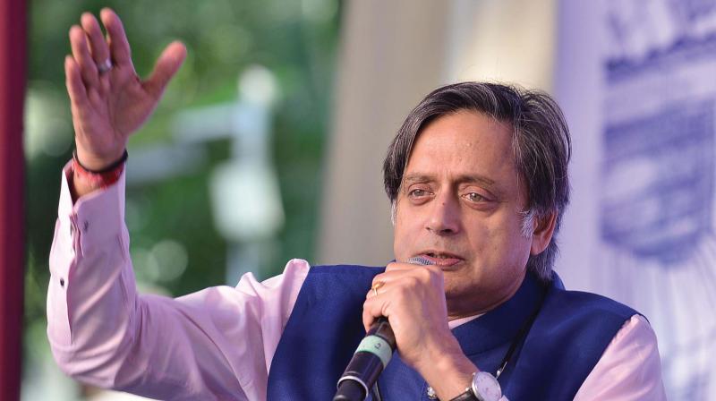Congress MP Shashi Tharoor reads an excerpt from his  latest book The Paradoxical Prime Minister during Bangalore Literature Festival on Sunday 	Shashidhar B.