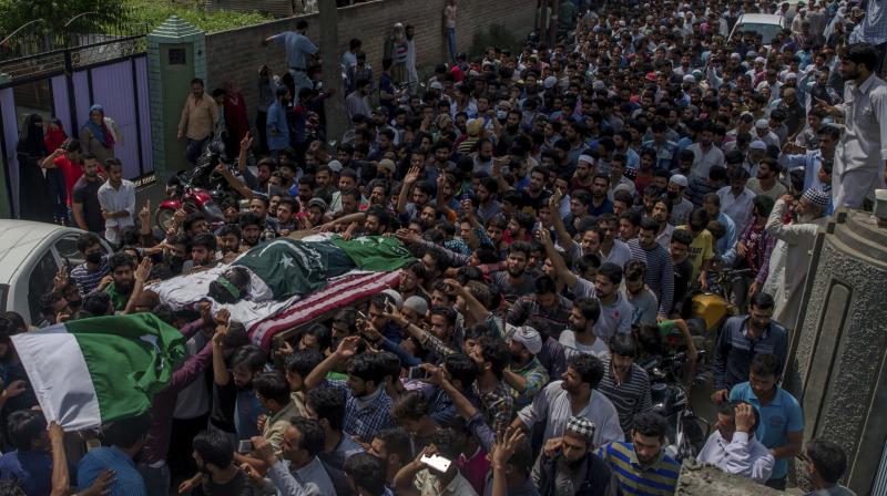 Kashmiris carry body of local rebel Adil Ahmed, during his funeral procession in the outskirts of Srinagar, Indian controlled Kashmir. (Photo: AP)