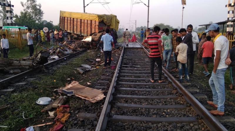 The accident took place between 6:30 am and 6:45 am when truck rammed into train after breaking closed level crossing gate on Sajeli road between Thandla and Meghnagar railway stations. (Photo: ANI)