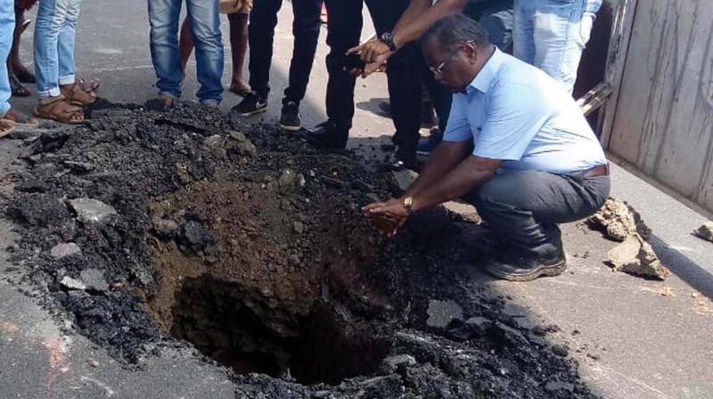 A portion of the National Highway 66 near Metro station at Kalamassery caved in on Wednesday forming a crater.           ( Image: Arun Chandrabose )