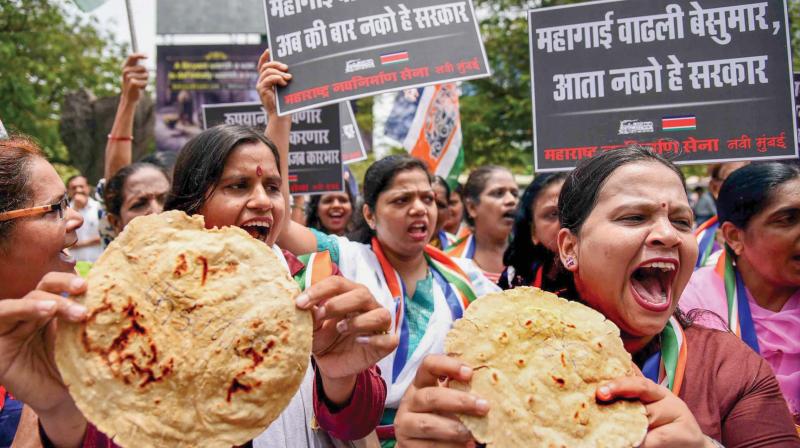 Members of MNS Womens Wing (left) stage a demonstration to protest against hike in fuel prices    (Image: PTI)