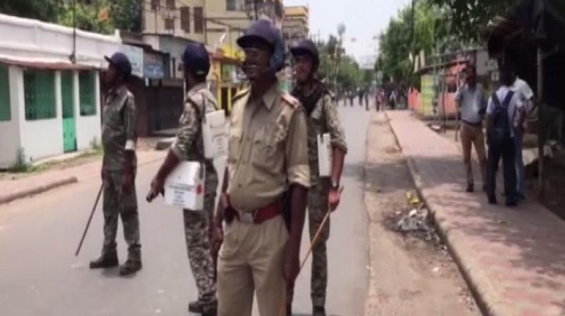 Police and the Rapid Action Force (RAF) personnel were deployed at the spot to control the agitated crowd that sought the reimbursement of the cut money. (Photo: ANI)