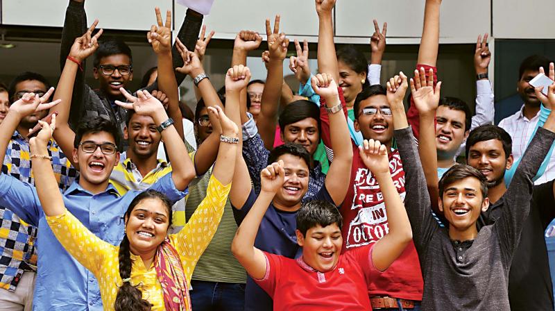 Students celebrate after the CBSE 12th results were announced at Venus International Public School, Rajajinagar, in Bengaluru on Saturday  (Image: DC)