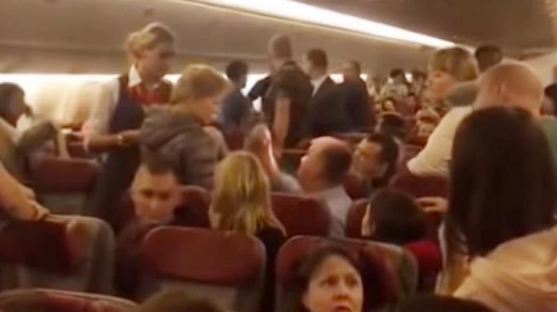 \Highâ€™ drama: Flight forced to land after drunk man tries to open door at 33k feet