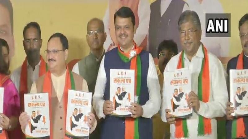 BJP Working President J P Nadda and Maharashtra CM Devendra Fadnavis releasing part manifesto. (Photo: ANI)