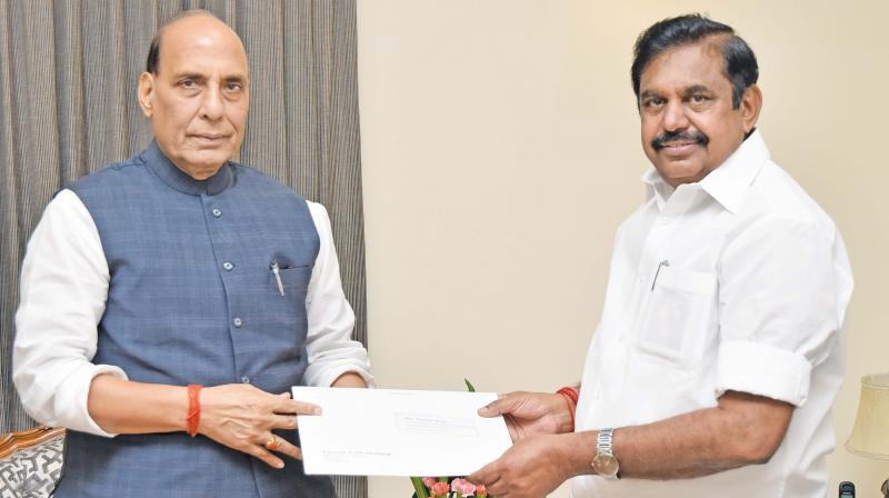 TN CM meets Rajnath Singh, seeks land transfer for projects