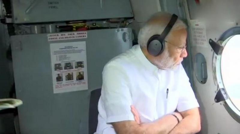 Prime Minister Narendra Modi conducted aerial survey of flood-hit Kerala where 324 people have died in last nine days. (Photo: Twitter | ANI)
