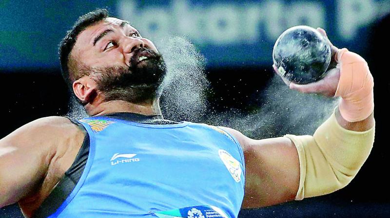 Tajinderpal Singh Toor throws the iron ball in the mens shot put final during the athletics competition  in Jakarta on Saturday. Toor won with a throw of 20.75 metres.	 (Photo:AP)