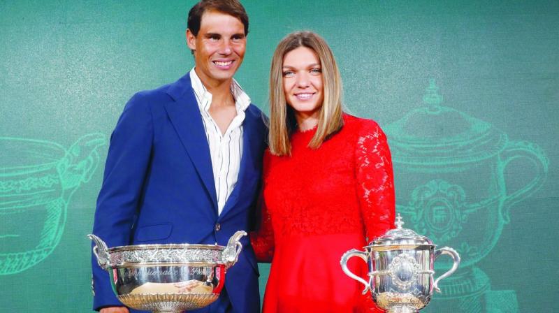 Defending  champions Rafael Nadal and Simona Halep during the draw of the French Open in Paris. (Photo: AP)