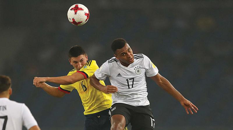 Germanys Maurice Malone (right) and Colombias Fabian Angel in action in their Fifa Under-17 World Cup round of 16 match in New Delhi on Monday. Germany won 4-0. (Photo: AP)