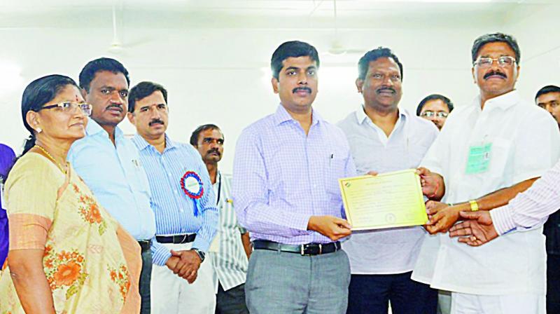 YSRC MLC candidate V. Gopal Reddy receives a declaration form from the collector Kona Sasidhar at Anantapur on Wednesday. Mr Gopal reddy won the graduate MLC polls from Rayalaseema West seat (Anantapur, Kurnool and Kadapa) by 12,540 votes majority against TD nominee K.J. Reddy. (Photo: DC)