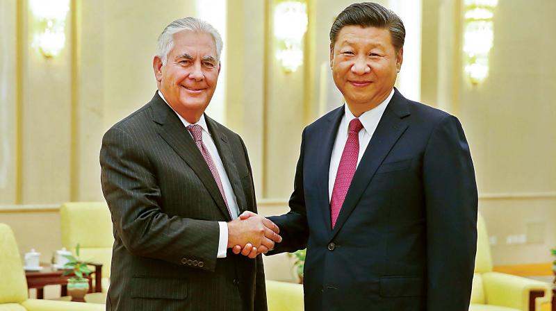 US secretary of state Rex Tillerson (L) shakes hands with Chinese President Xi Jinping at the Great Hall of the People, in Beijing on Saturday 	(Photo: AFP)
