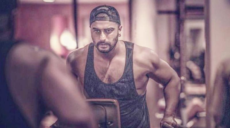 Arjun Kapoor flaunts his muscles, reveals story on battling from obesity; see pics