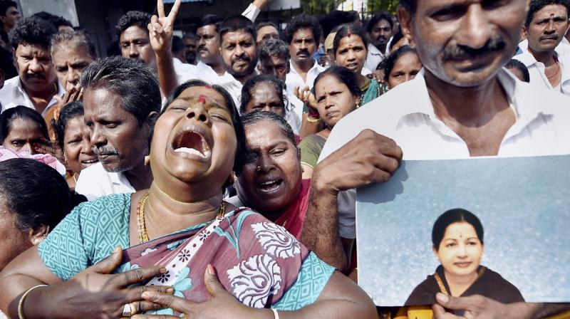 Supporters of late Tamil Nadu Chief Minister Jayalalithaa cry in front of Apollo hospital after Jayalalithaa suffered a cardiac arrest in Chennai. (Photo: PTI)