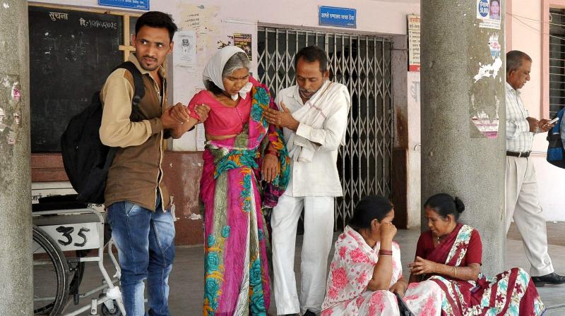 Patients wait outside the OPD at GMC hospital as resident doctors were on a strike in Nagpur. (Photo: PTI)