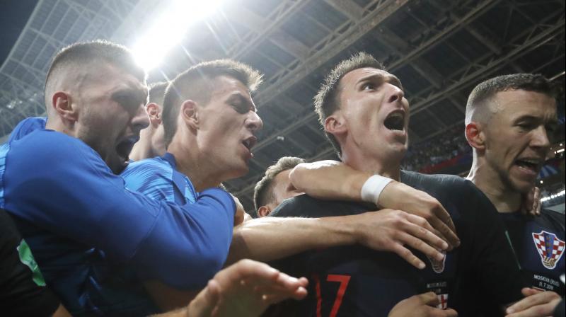Croatia players celebrate the match-winning goal. (Photo: AP)