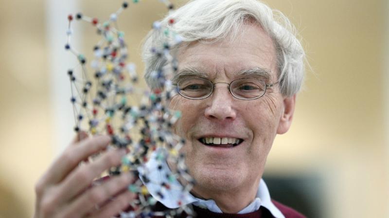 Richard Henderson, one of the 2017 Nobel Prize winners in Chemistry, holds a bacterio rhodopsin model prior to a press conference at the Laboratory of Molecular Biology in Cambridge, England, Wednesday, Oct. 4, 2017. Three researchers based in the U.S., U.K. and Switzerland won the Nobel Prize in Chemistry on Wednesday for developments in electron microscopy. The 9-million-kronor ($1.1 million) prize is shared by Jacques Dubochet of the University of Lausanne, Joachim Frank at New Yorks Columbia University and Richard Henderson of MRC Laboratory of Molecular Biology in Cambridge, Britain. (Frank Augstein/Associated Press)