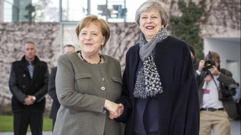 Theresa May to request Merkel, Macron for Brexit delay