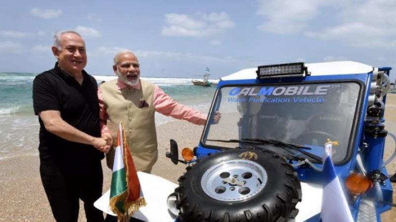 Netanyahu and Modi waded into the Mediterranean Sea and rode the buggy jeep on the coast during the latters visit to Israel in July 2017. (Photo: Twitter/@PIB_India)