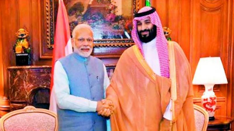 Prime Minister Narendra Modi shakes hands with Saudi Crown Prince Mohammed bin Salman on the sidelines of G20 Summit, in  Argentina on Thursday.	(PTI)