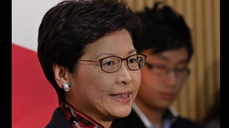 Hong Kong Chief Secretary Carrie Lam talks to reporters during a press conference at the government headquarters as she announces her resignation in Hong Kong, Thursday (Photo: AP)