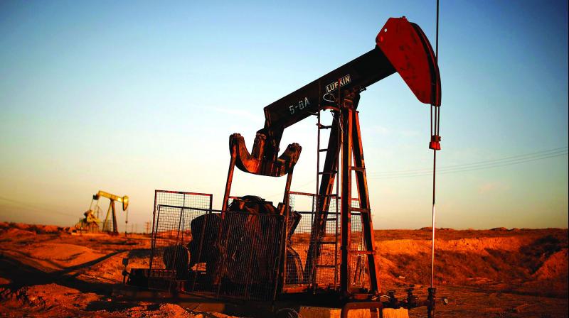 Oil hovers around $50s as global demand weakens