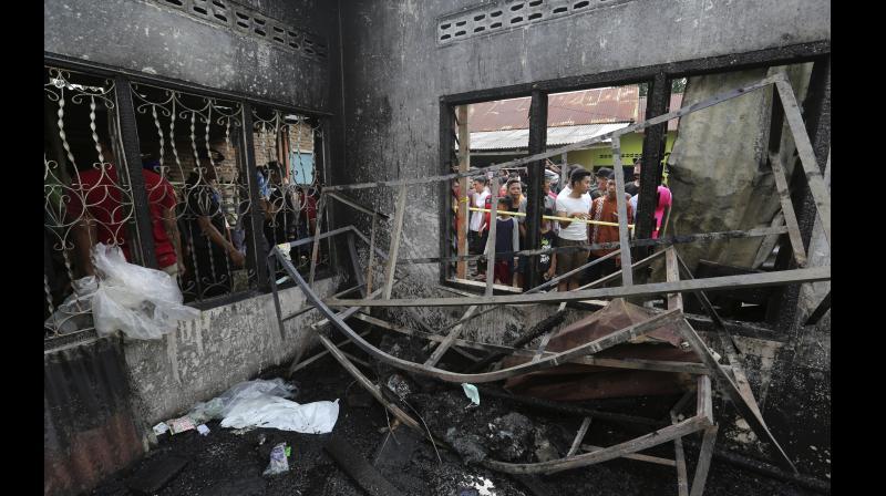 2 suspects in deadly Indonesian lighter factory fire probe