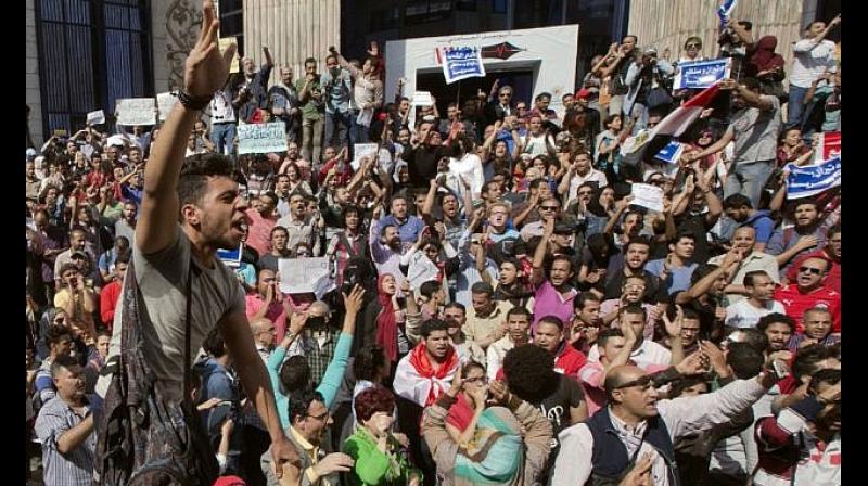 At least eight protesters were detained and accused of \association with a terrorist organisation\ after joining a small protest in Cairo. (Photo: AP)