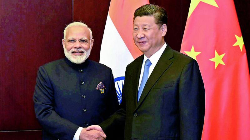 Prime Minister Narendra Modi and Chinese President Xi Jinping at the SCO Summit in Astana. (Photo: PTI)