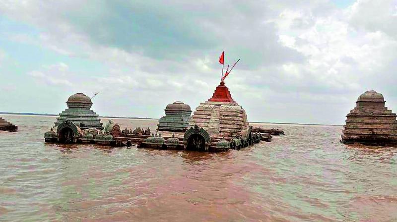 A temple being submerged in water.  	 File photo