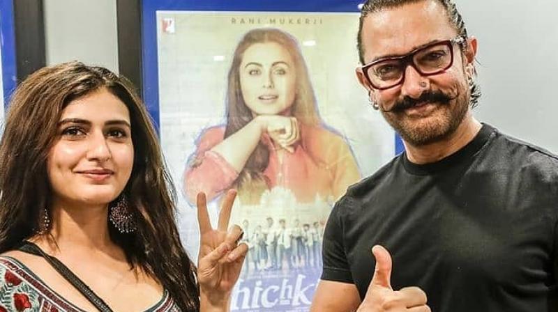Aamir Khan and Fatima Sana Shaikh pose after watching Rani Mukerjis Hichki.