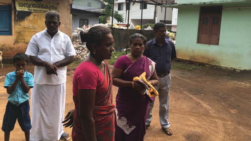 Murukans relatives wait in front of Kollam District Hospital as they were denied an ambulance to take his body back home to Thirunelveli.  (Photo: DC)