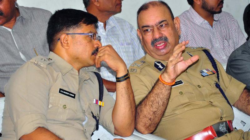 DGP, North zone, Rajesh Dewan and district police  commissioner Kaliraj  Mahesh Kumar in a discussion at the function to declare Total POCSO literate police District on Tuesday.	(Photo: DC)
