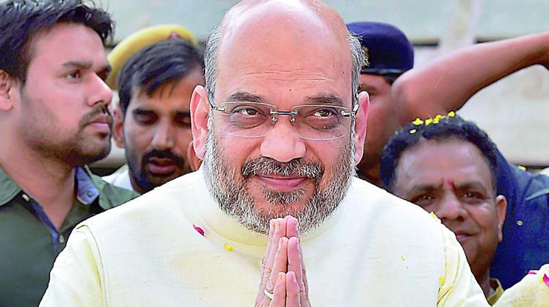 BJP National President Amit Shah arrives for a party office bearers meeting at NDMC Convention Centre, in New Delhi on Sunday.  (Photo:  PTI)