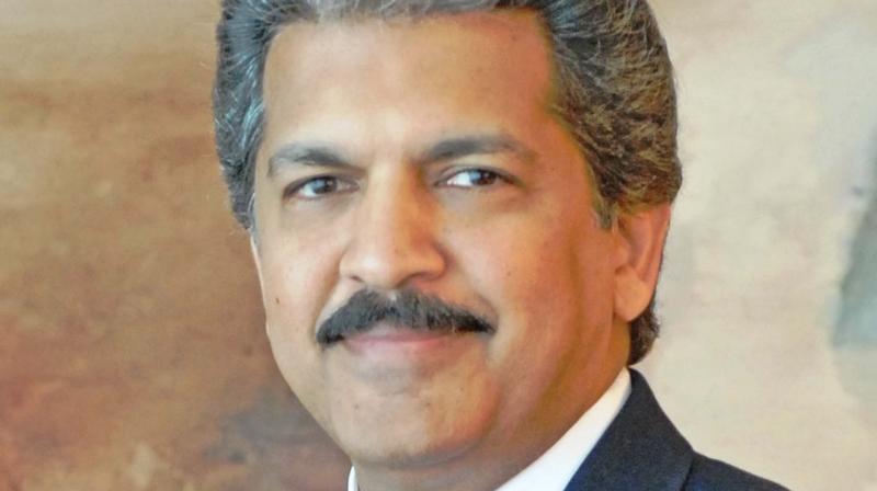 \Cut taxes or rollback cess as auto gloom deepens\: Anand Mahindra