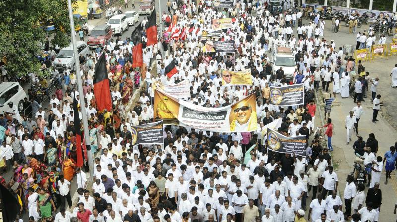DMK leaders, cadres take out peace march to MK memorial