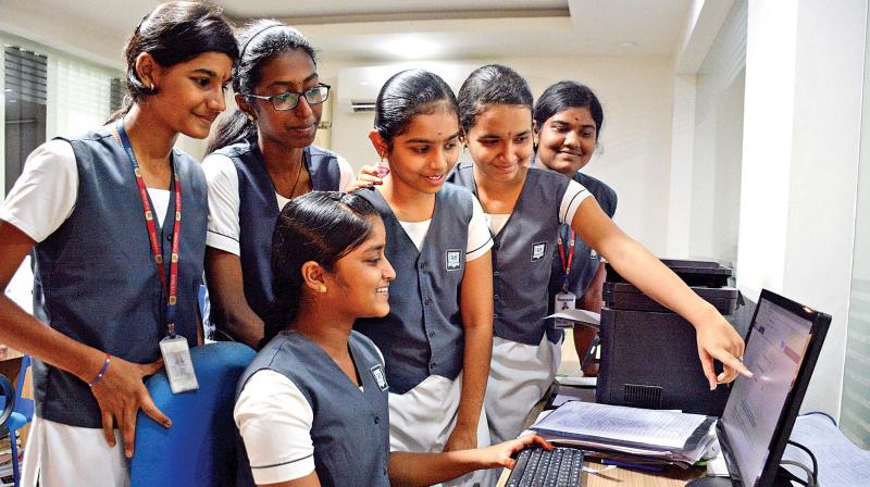 Student of Everwin school, Kolathur check their results on Wednesday (Photo: DC)