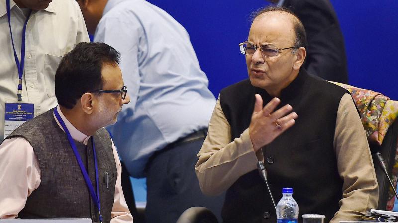 Union Finance Minister, Arun Jaitley and Revenue Secretary Hasmukh Adhia at the 6th Goods and Services Tax (GST) Council meeting in New Delhi on Sunday. (Photo: PTI)