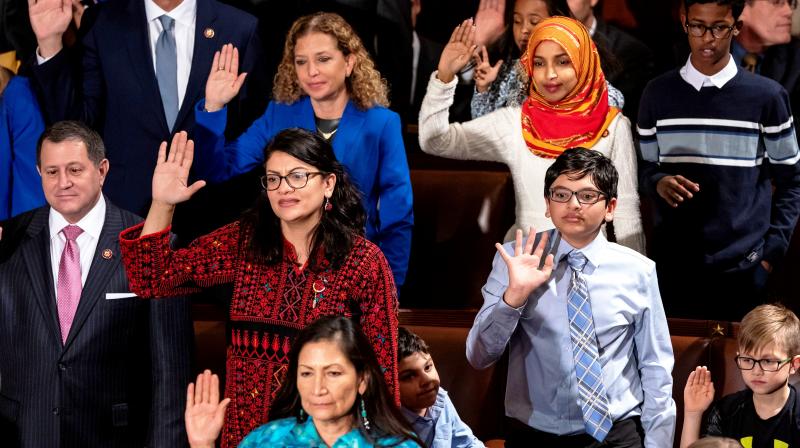 Tlaib (center left) proudly wore her thobe to her historic swearing-in as the first Palestinian American member of Congress, inspiring women around the world to tweet photos of themselves in their ancestral robes. (Photo: AP)