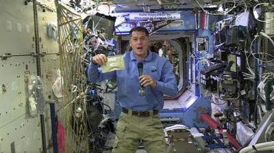 NASA astronaut Shane Kimbrough shows a pouch of turkey he will be preparing for his crew in celebration of the Thanksgiving holiday, aboard the International Space Station. (Photo: AP)