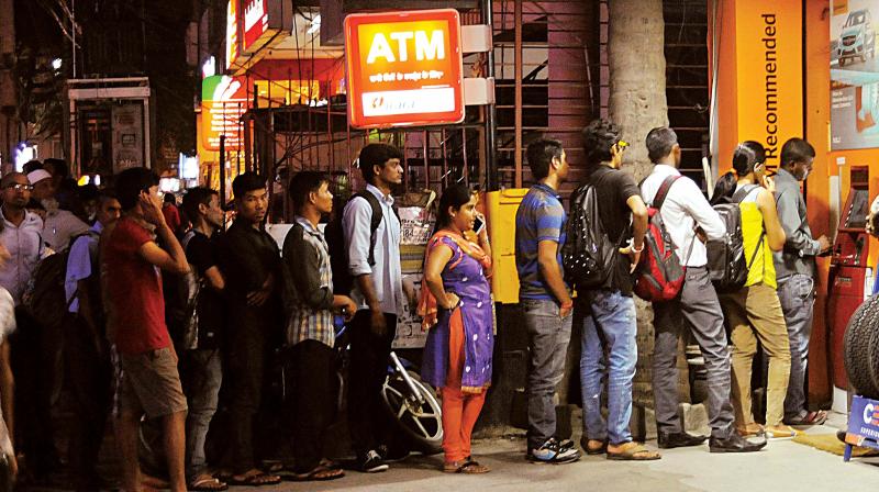 A queue in front of an ATM at Koramangala in Bengaluru on Tuesday. (Photo: DC)