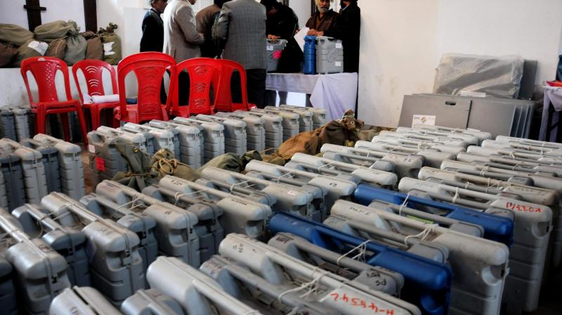 Officials collecting Electronic Voting Machines (EVM) (Photo: PTI)
