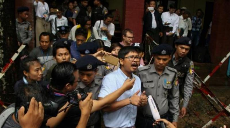 Detained journalist Wa Lone speaks to the media after exiting the court on July 9, 2018. (Photo: AFP)