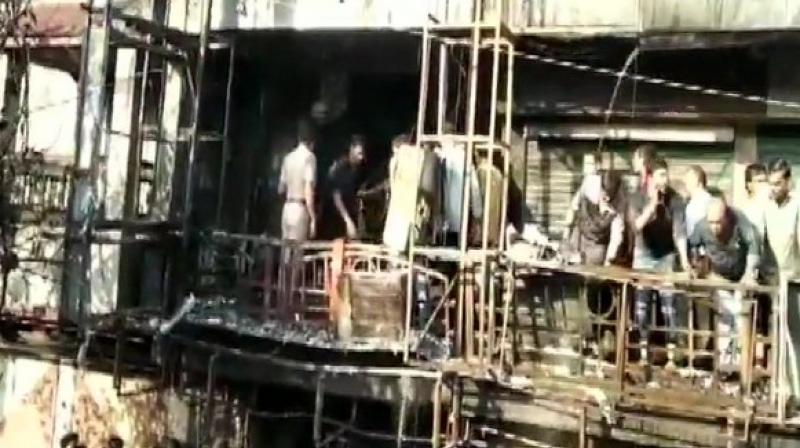 Surat fire: 20 charred to death, 1 arrested, 2 fire officers suspended