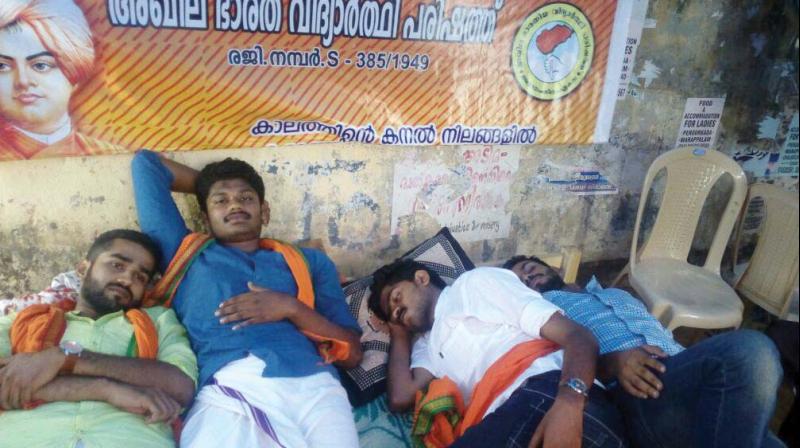 ABVP activists fast in front of the Kerala Law Academy Law College on Saturday.