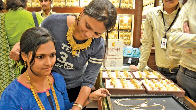 Young girls buy gold jewellery in a shop at T Nagar, on the occasion of Akshaya Tritiya on Friday. (Photo: DC)