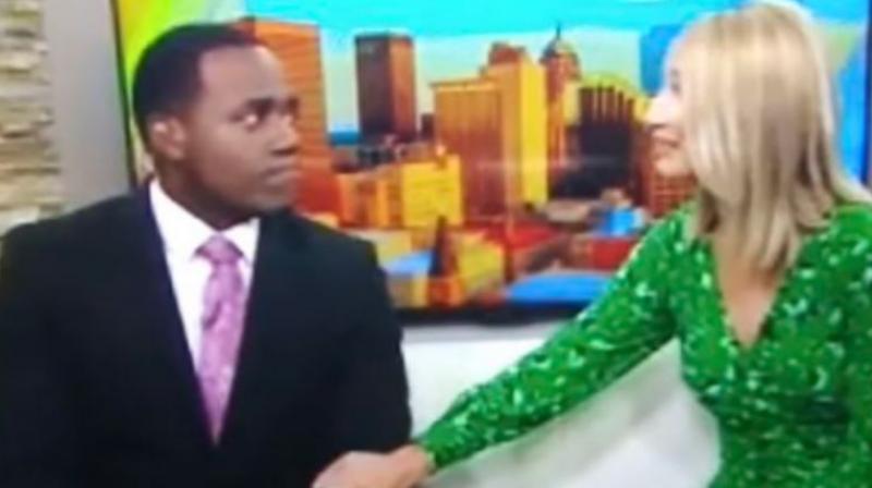 US TV anchor issues apology for comparing black co-host to an ape