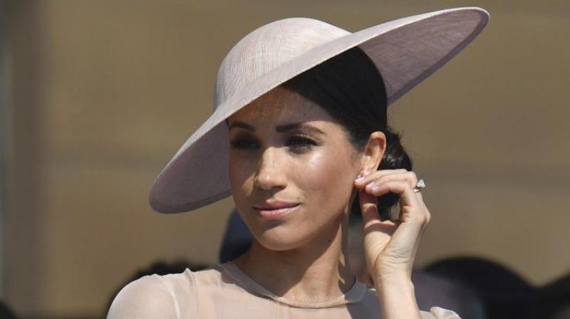 Meghan, the Duchess of Sussex gestures as she attends a garden party at Buckingham Palace in London, Tuesday May 22, 2018, her first royal engagement since her wedding to Prince Harry on Saturday. (Photo: AP)