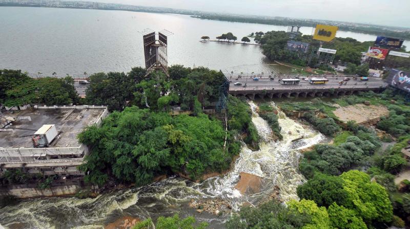 The Hussain Sagar Lake overflows following incessant rains in Hyderabad on Tuesday. (Photo: PTI)