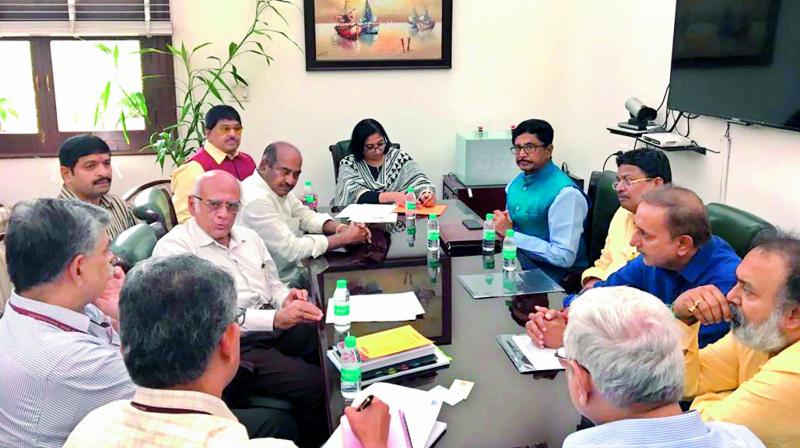 A file photo shows a delegation from the AP film industry holding discussions with GST Council ex-officio secretary Hasmukh Adhia after submitting a representation seeking revamp of GST pertaining to the Telugu film industry in New Delhi recently.